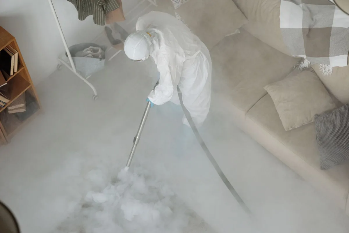 Biohazard cleanup technician in protective equipment, White House, TN